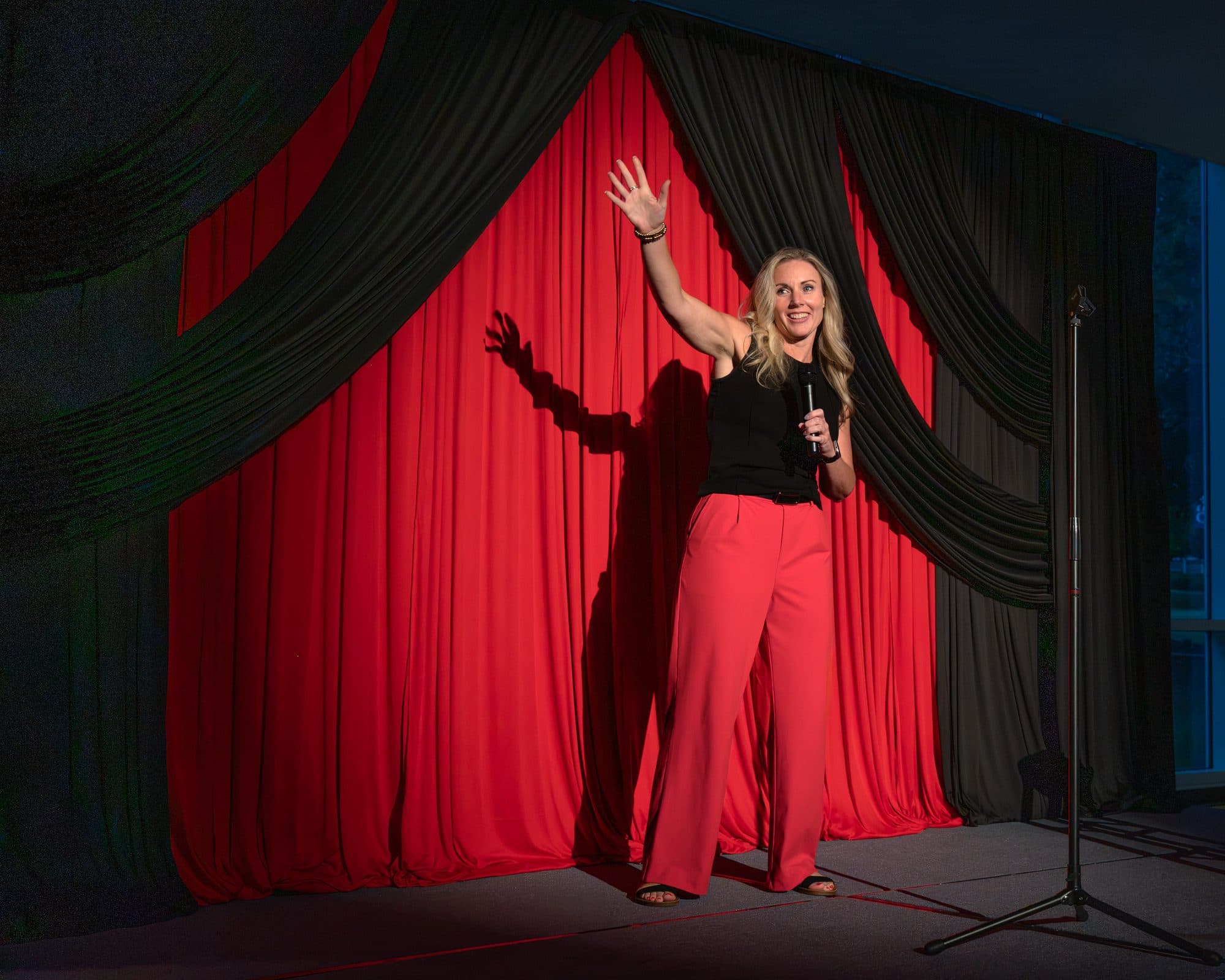 Comedian performing a stand-up set on stage at Mic Drop Masters 2026.