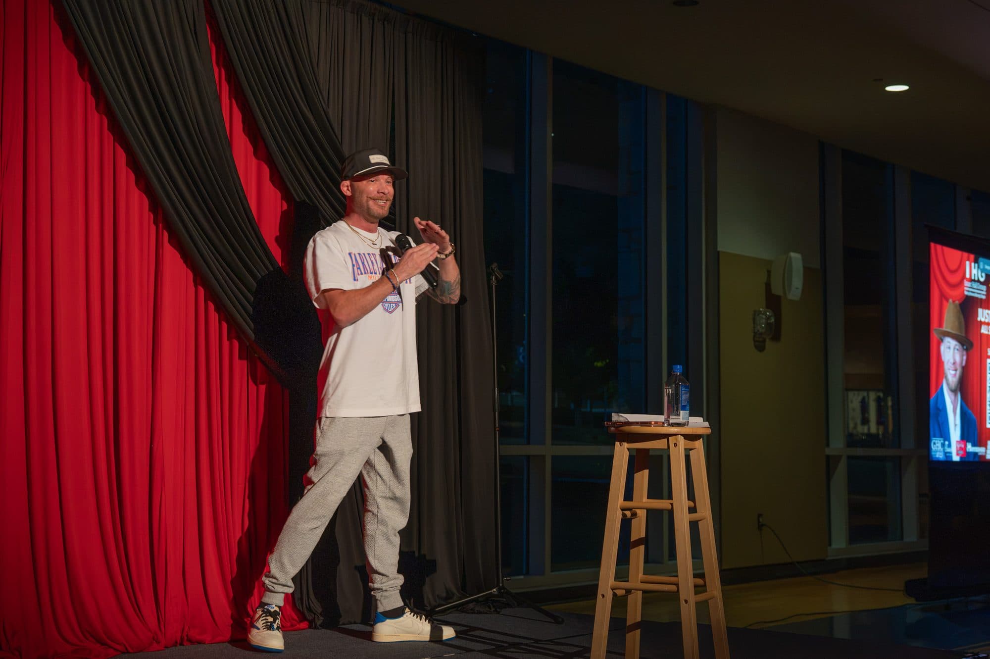 Comedian performing a stand-up set on stage at Mic Drop Masters 2026.
