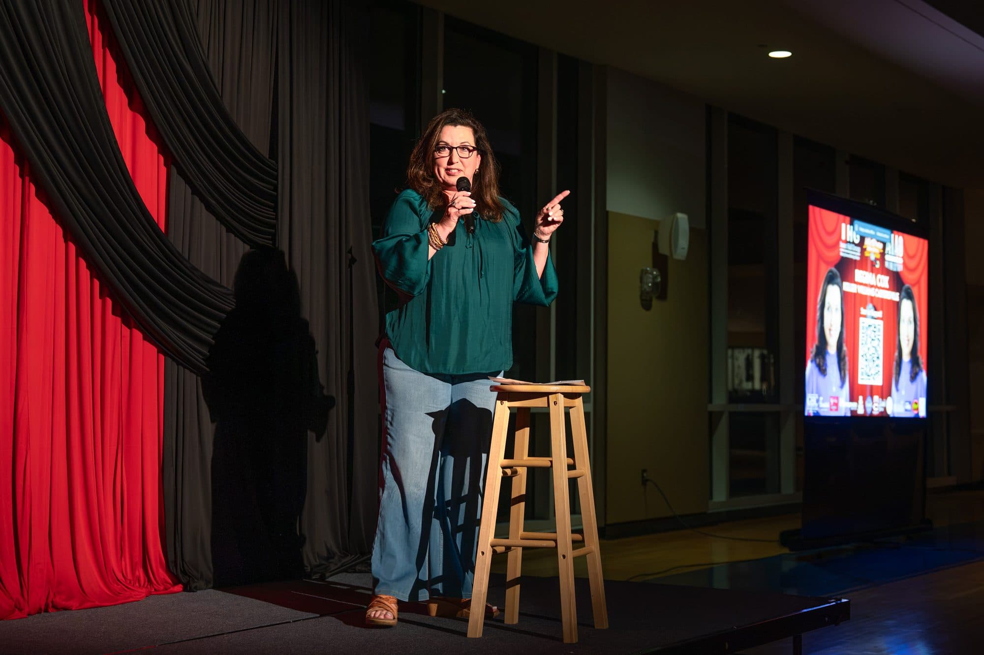 Comedian performing a stand-up set on stage at Mic Drop Masters 2026.